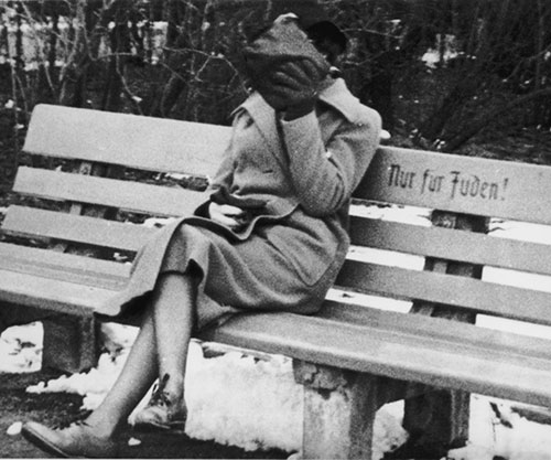 A-Jewish-woman-who-is-concealing-her-face-sits-on-a-park-bench-marked-Only-for-Jews-Austria-1938small.jpg-1845531184.jpeg