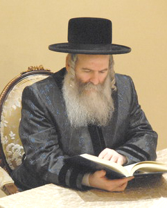 5. Ruv looks in sefer.jpg