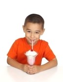 5136480-six-year-old-boy-drinking-milk-shake-on-white-background.jpg